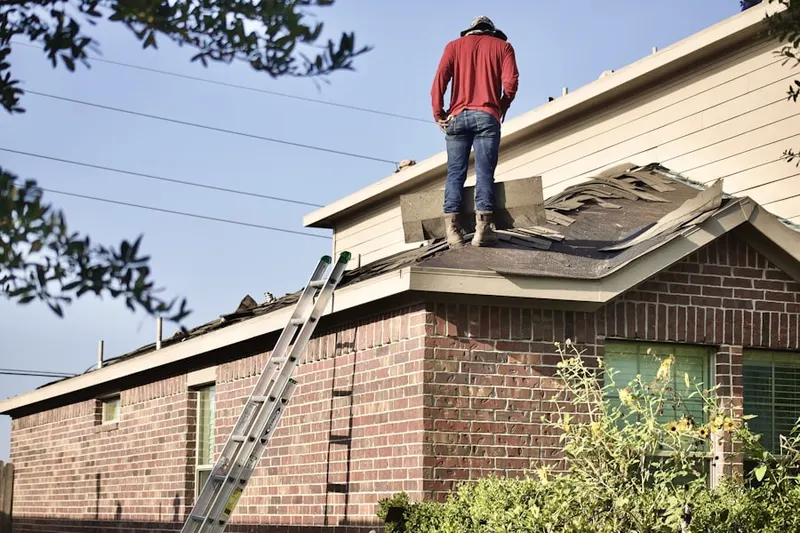 Professional roofer working on a residential roof in Horseshoe Bay